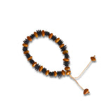 Pulseira de sementes ajustável com contas laranja e azul-marinho, cordão com pontas.